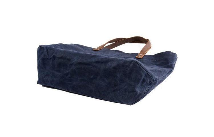 large blue leather canvas tote