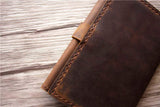 brown leather wallet for passport and field notes