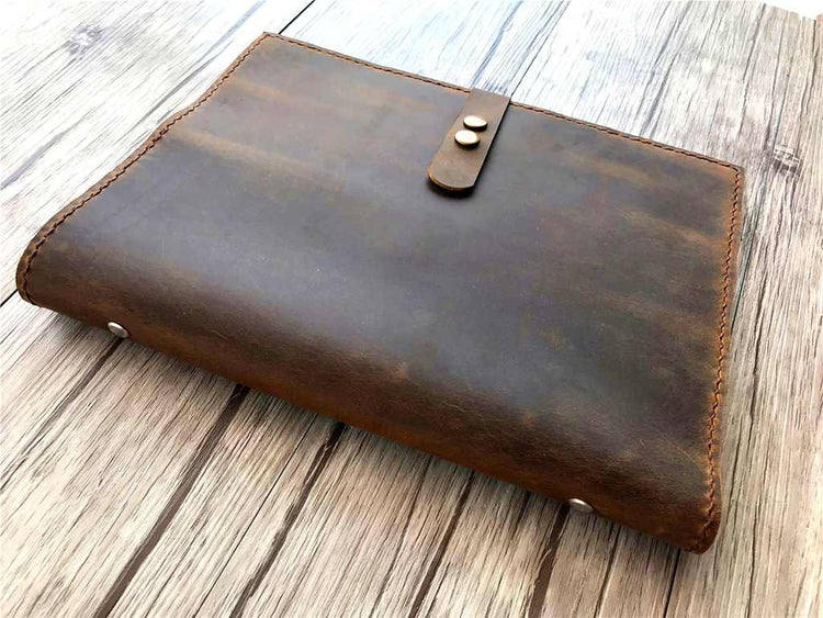 brown leather binder bag