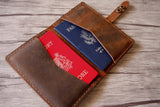 distressed brown leather passport holder