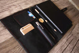 black leather notebook case with red thread