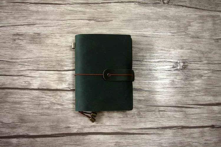distressed green leather travelers notebook