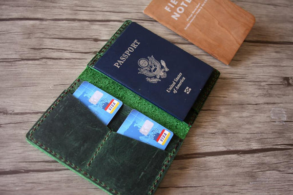green leather passport sleeve